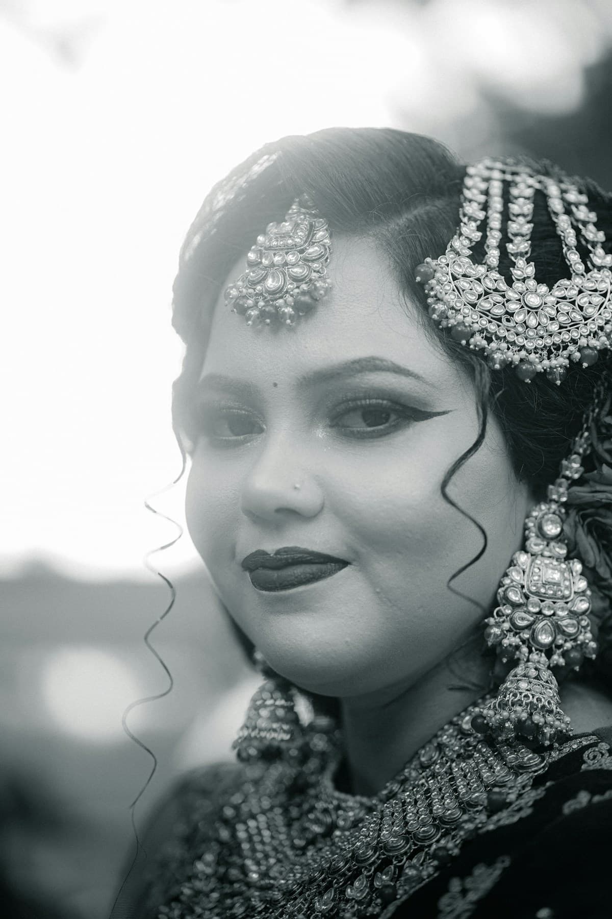 An Indian bride wearing traditional jewellery and elegant makeup