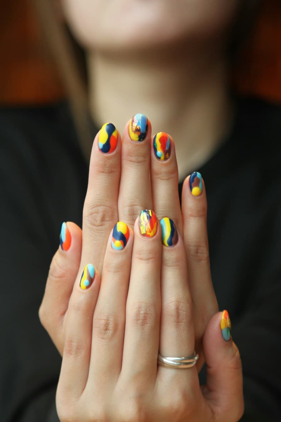 A colourful, carefully finished manicure